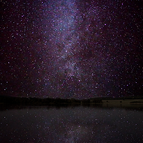 Starry sky, reflections on a water.