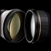 Nikon and Canon teleobjective lenses.