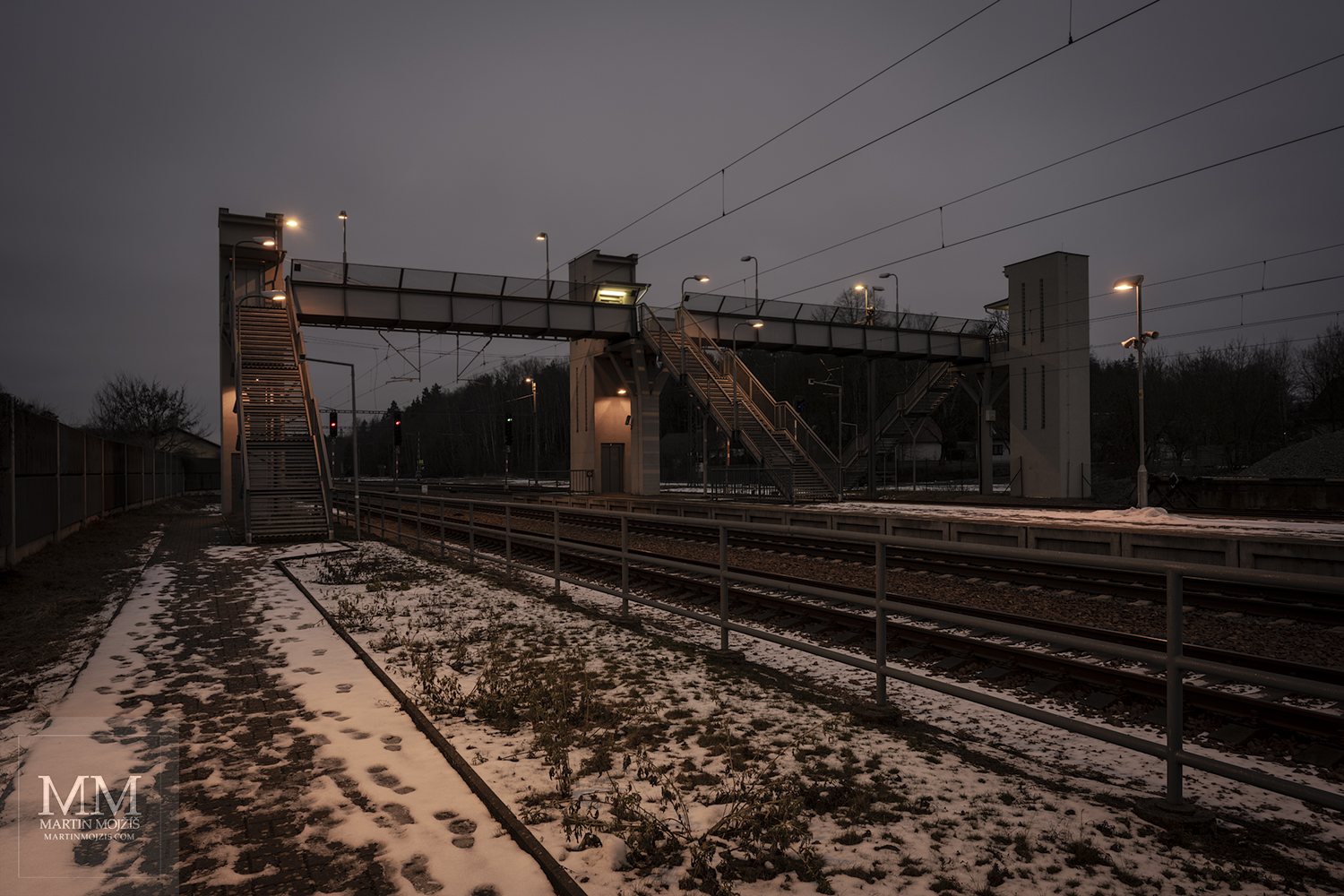 Crossing the tracks in dusk.