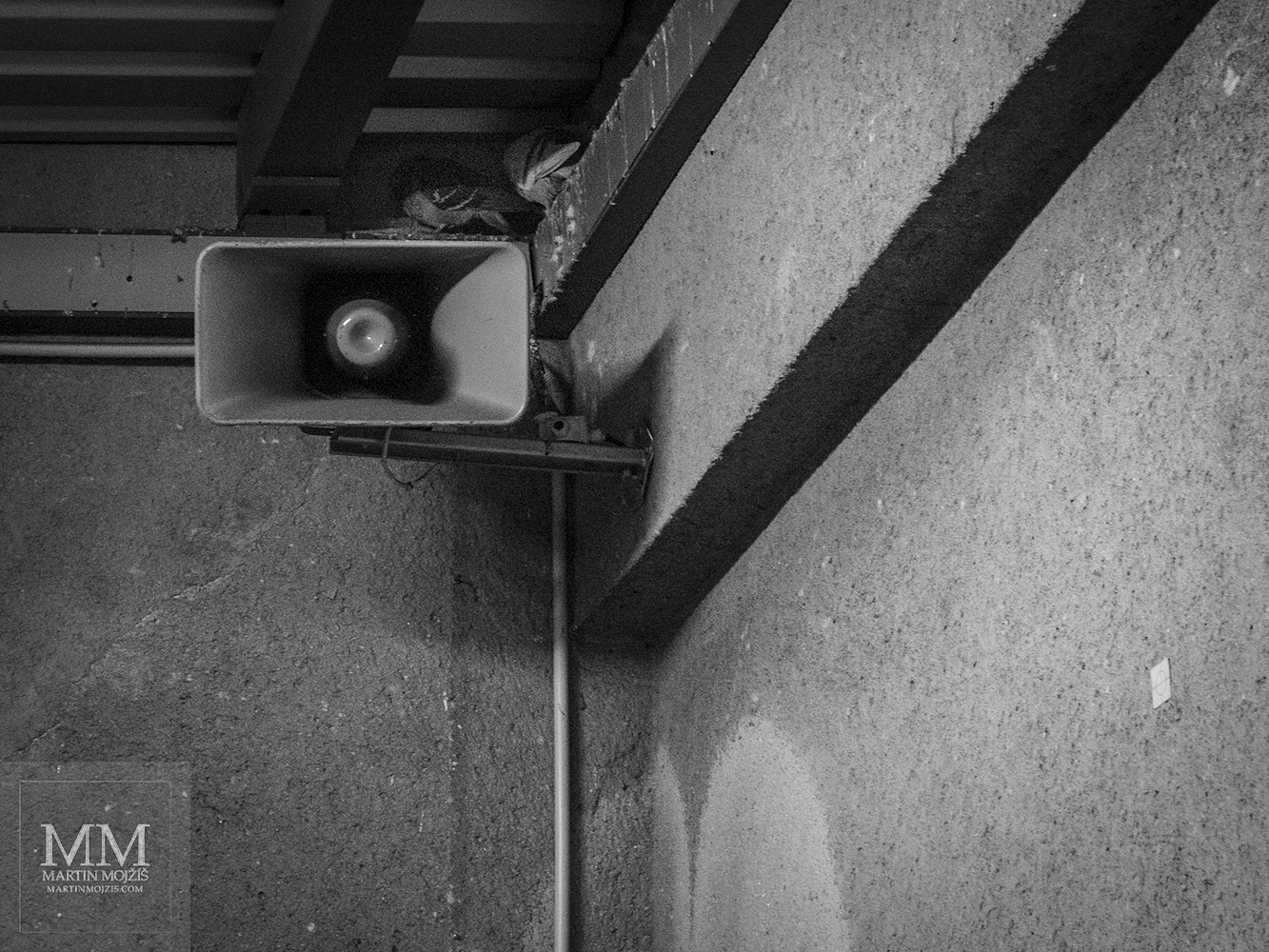 Pigeons nesting above one of the speakers. Zdice railway station.