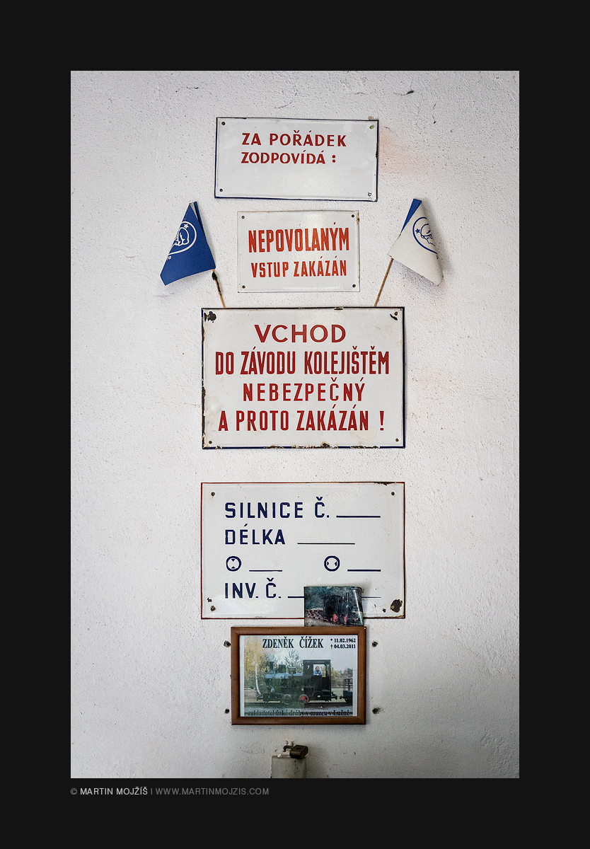 Various signs and flags on the wall. Railway muzeum in Luzna near Rakovnik.