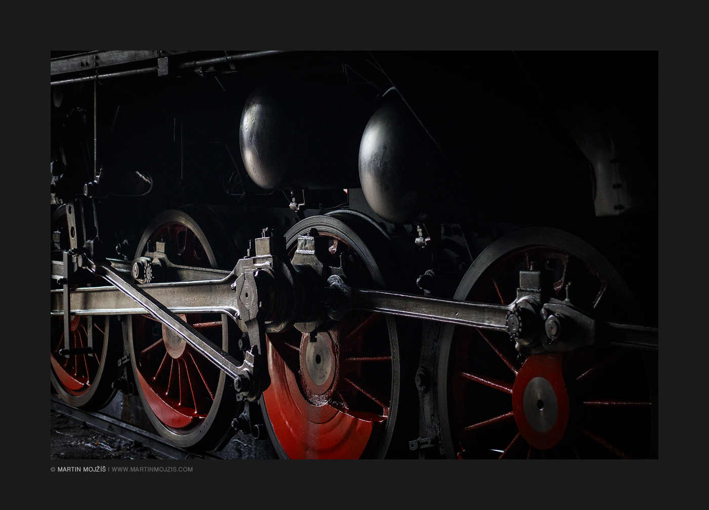 Steam locomotive wheels and rods close up. Railway (railroad) museum in Luzna near Rakovnik.