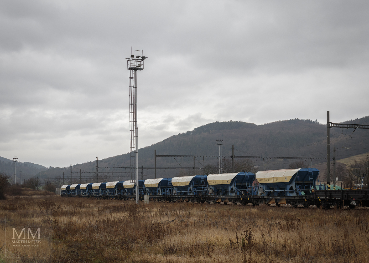 Blue Faccs wagons, in the background the Holy hill. Zdice station in new.