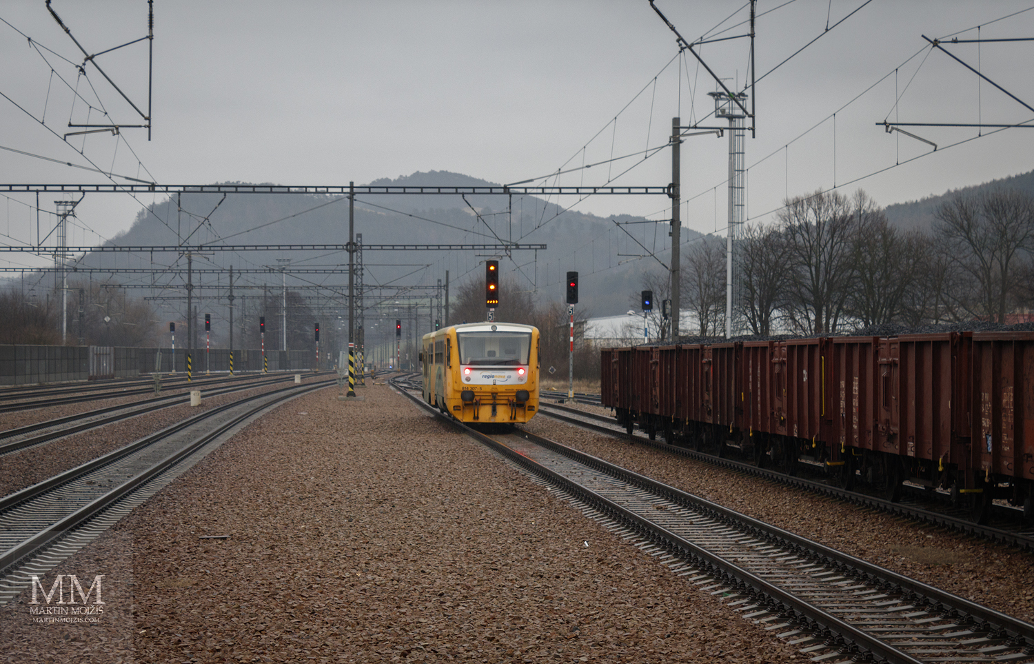 The engine train set goes north-east towards Beroun. Zdice station in new.