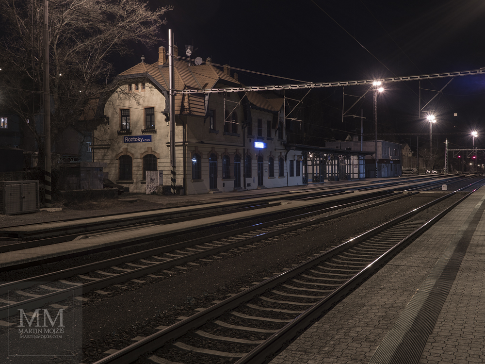 Roztoky near Prague railway station at night, cooler colors. Photograph created with the Olympus OM-D E-M1 Mark II photographic camera.