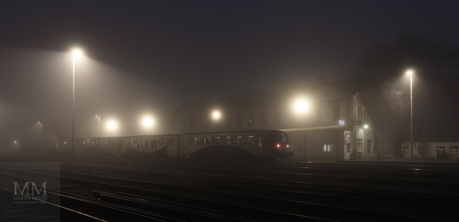 Large format, fine art photograph of railway station in evening fog. Martin Mojzis.