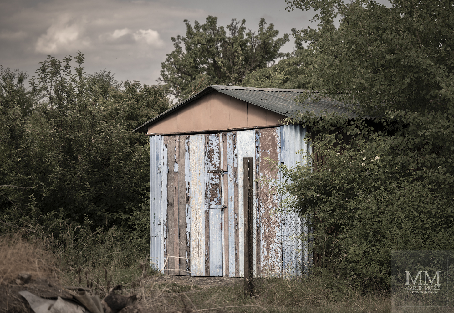 A old weathered garage. Fine art photograph NEAR A RAILWAY STATION, photographed by Martin Mojzis.