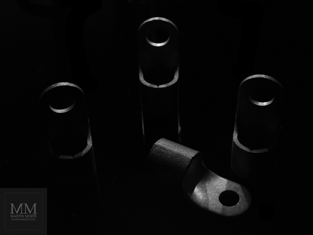 A group of objects similar to high-backed chairs, one inverted. Photograph with the title LEAVE.