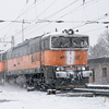 Diesel locomotive Brejlovec in snowy landscape.